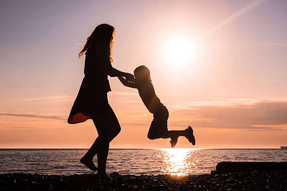 lighthousetreatment-5-appealing-rehab-features-for-single-parents-article-photo-silhouettes-dance-with-the-sun-graceful-girl-dancing-with-her-son-649139644