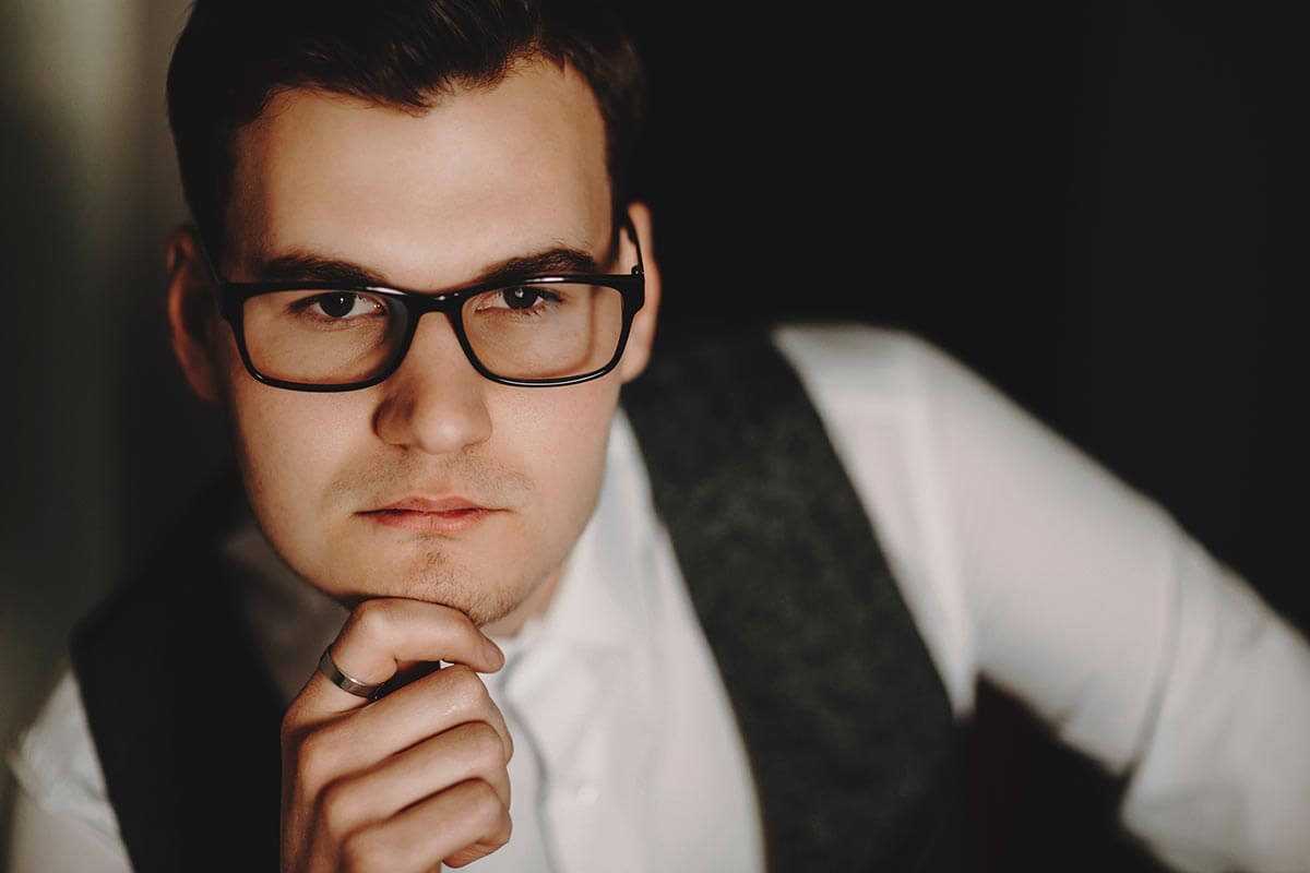 lighthousetreatment-the-relation-between-iq-and-drug-addiction-article-photo-closeup-portrait-of-young-businessman-wearing-glasses-and-looking-at-camera-1065320855