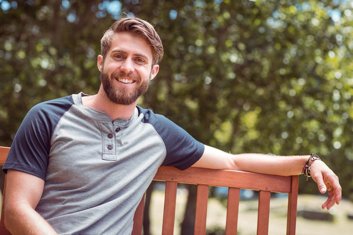 lighthousetreatment-long-days-and-nights-how-to-stay-sober-over-the-summer-article-photo-young-man-relaxing-on-park-bench-on-a-summers-day