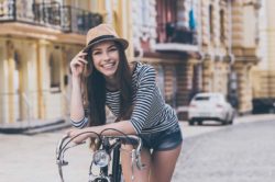 lighthousetreatment-how-to-replace-addiction-with-a-new-passion-article-photo-funky-beauty-beautiful-young-woman-leaning-at-her-bicycle-and-smiling-while-standing-outdoors